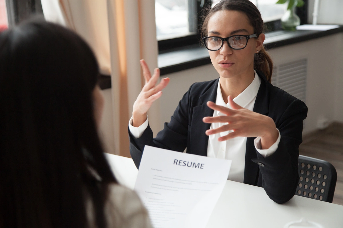 confident-millennial-female-applicant-glasses-talking-job-interview